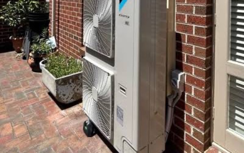 Daikin multi-head outdoor unit installed in a courtyard