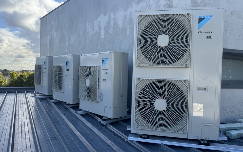 Bank of Daikin VRV outdoor units on a commercial rooftop
